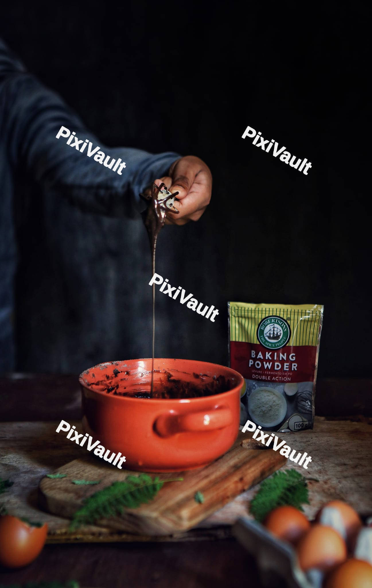 A person stirring a cocoa powder